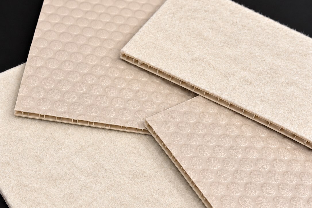 Gray bubble board samples showing the raised bubble face, the felt back and the honeycomb core