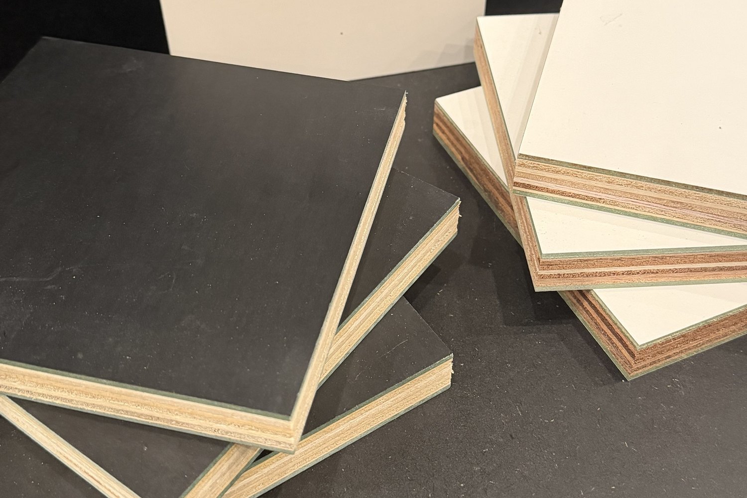 White and black laminated plywood samples showing the plywood core