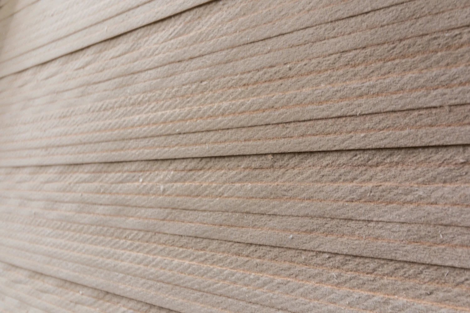 Edges of stacked softboard insulation board