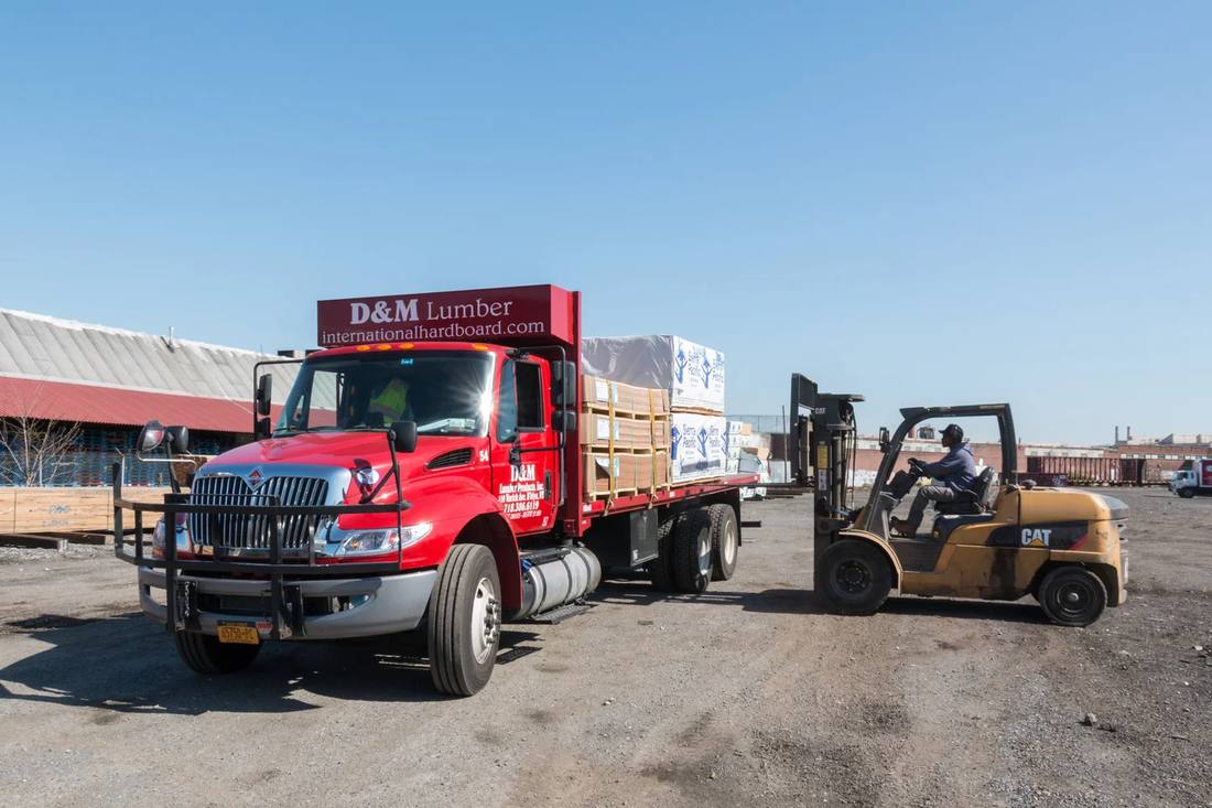 A D&M truck and forklift at the rail yard